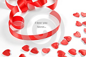 Love background. Small hearts and ribbon