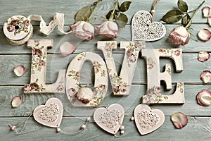 Love background with vintage style letters and roses