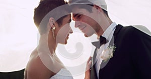 Love is a beautiful thing to see. 4k video footage of an affectionate young newlywed couple sharing an intimate moment