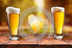 Love beer. Beer in glass with heart splash on wooden table again