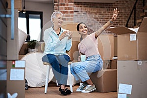 Love is the best thing to furnish a home with. a senior woman moving house with help from her daughter.