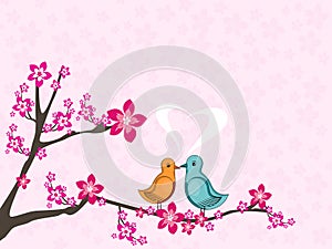 Love birds sitting on tree branch