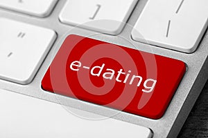 Love button on laptop keyboard, closeup. Online dating site