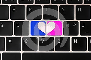 Love buttons on laptop keyboard, top view. Online dating site