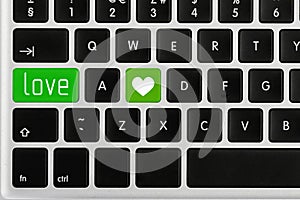 Love buttons on laptop keyboard, top view. Online dating site