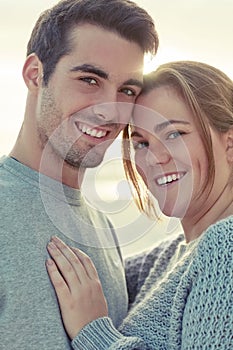 Love changes everything. Portrait of a happy young couple bonding outside.