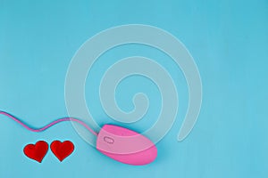 Love chat, online dating. Pink computer mouse with red fabric he