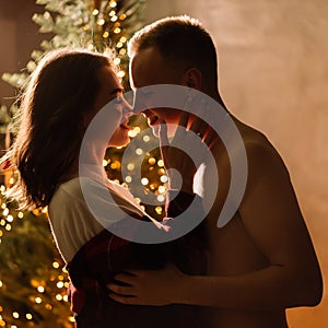 Love, christmas, couple, proposal concept - happy man giving diamond engagement ring to woman