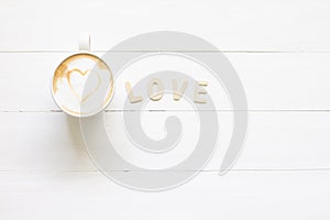 Love coffee cup of latte art with heartin white cup, romantic for valentine's Day  on wood background
