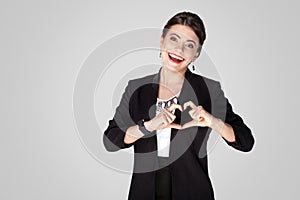 Love concept. Creative woman showing heart shape sign