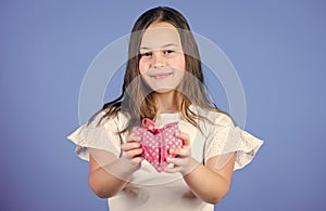 Love concept. Girl cute child show heart toy. Heart symbol of love. Kid adorable girl happy face show heart blue