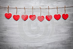 Love concept. Hearts hanging on a string