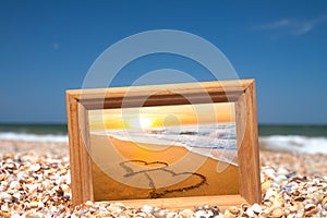 Love concept - two hearts on sand