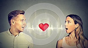Love connection. Man woman talking with heart in-between