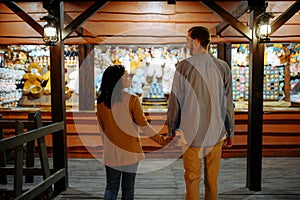 Love couple in amusement park souvenir shop