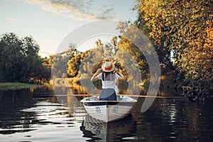 Love couple in boat on quiet lake, daydream