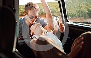 Love, couple and car road trip in nature on vacation, holiday or summer trip. Travel, interracial woman and man spending