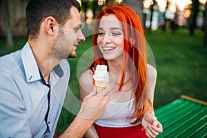 Love couple with cotton candy in summer park