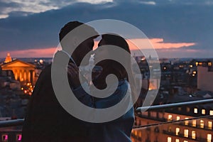 love, couple kissing on night city skyline view, romantic honeymoon in Paris, France