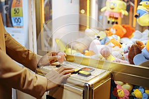 Love couple playing game machine, amusement park