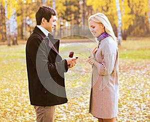 Love, couple, relationship and engagement concept -man proposing