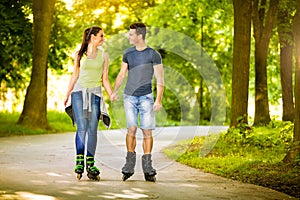 Love couple spending free time together on roller