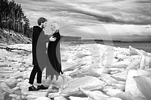 Love Couple stay on the ice floe, Thunder Sky and sea . melting glaciers