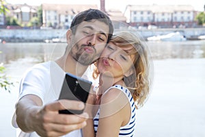 Love couple taking a picture with phone