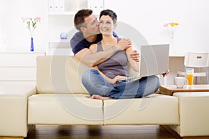 Love couple using laptop computer