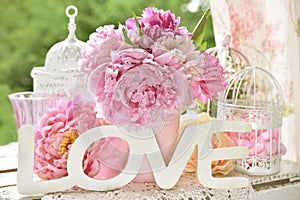 Love decoration with wooden letters and peony flowers with color