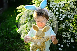 Love easter. Family holiday. Little boy child in green forest. Happy easter. Childhood. Rabbit kid with bunny ears. Hare