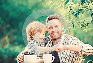 They love eating together. Weekend breakfast. healthy food. Family day bonding. father and son eat outdoor. small boy