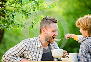 They love eating together. Weekend breakfast. small boy child with dad. organic and natural food. father and son eat