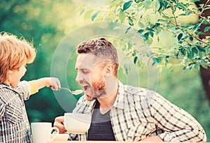 They love eating together. Weekend breakfast. small boy child with dad. organic and natural food. father and son eat