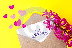 Love envelope and letter with written word always and pink hyacinth flowers with pink hearts