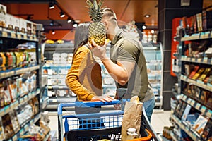 Love family couple kissing in grocery store