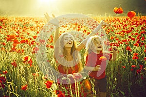 Love and family, happy mother and child in poppy field