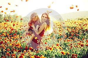 Love and family, happy mother and child in poppy field