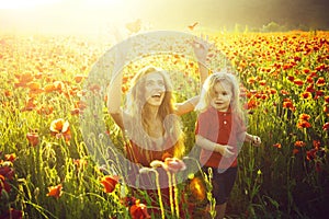 Love and family, happy mother and child in poppy field