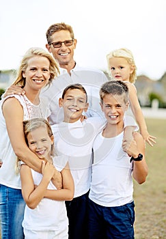 The love of a family is lifes greatest blessings. Shot of a happy family spending time together outdoors.