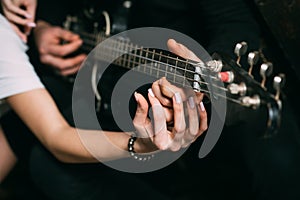 Love filled with music. Couple of musicians enjoy playing music. Couple in love play duets. Male and female hands play