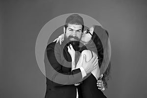 Love at first bite. Couple in love enjoy flirtation. Flirtation between sexy girl and bearded man. Flirtation and