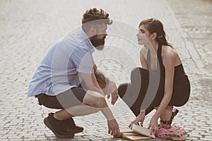 Love at first sight. Man and woman falling in love. Bearded man and cute woman met on street. Hipster helping and photo