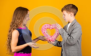 Love forever. Small boy give heart to little girl. Cute children celebrate Valentines day. Love and friendship. Holiday