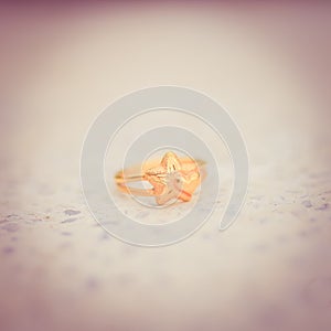 Love gold ring put on ground vintage style