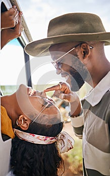 Love, happy and black couple nose touch for playful road trip bonding moment together in nature. Black woman and African