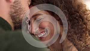 Love, happy couple and commitment while touching face, laughing and bonding closeup at home. Smiling man and woman in a