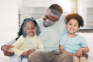 Love, happy and father on a sofa with his children embracing, relaxing and bonding in the family home. Happy, smile and