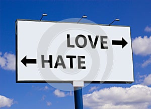 Love or hate symbol. Concept word Love or Hate on beautiful billboard with two arrows. Beautiful blue sky with clouds background.