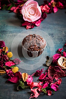 Love heart made of flower decoration with muffin